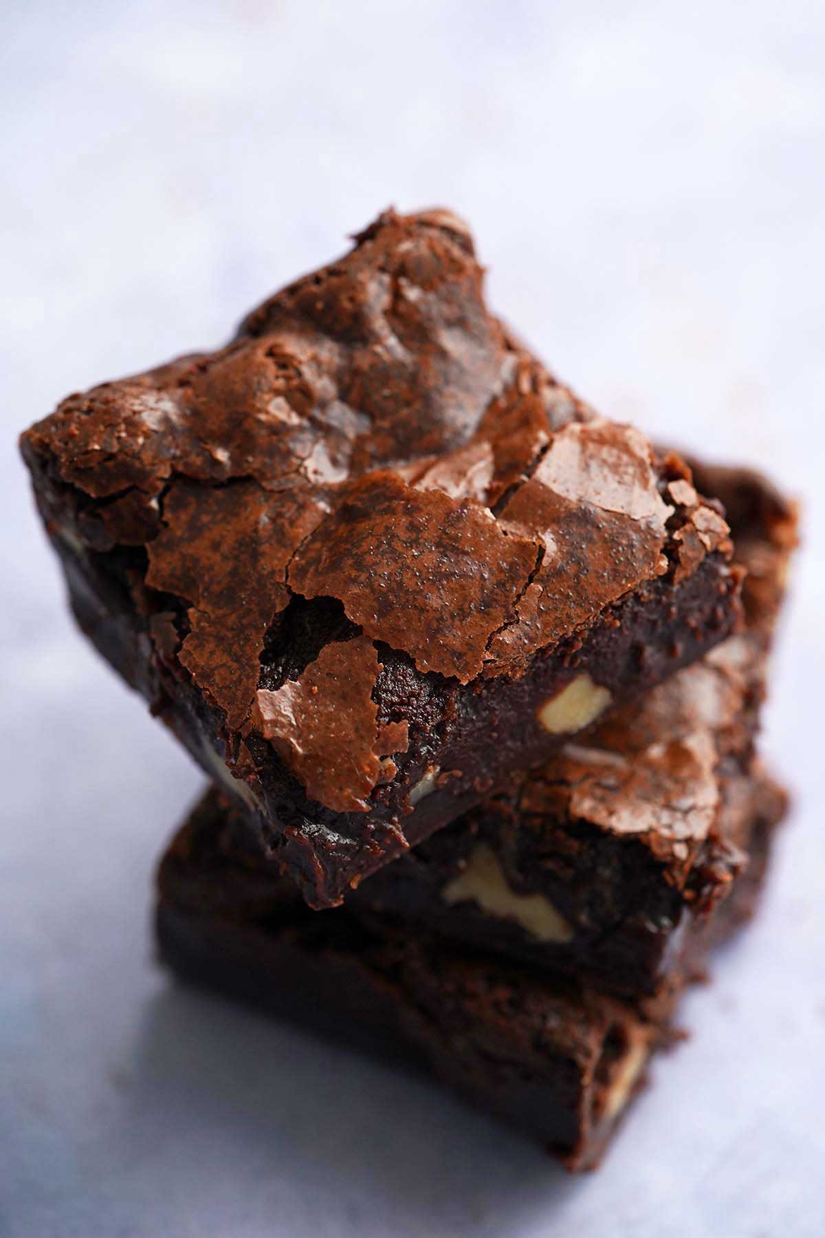 stack of fudgy chewy sourdough brownies made with cocoa powder without chocolate chips